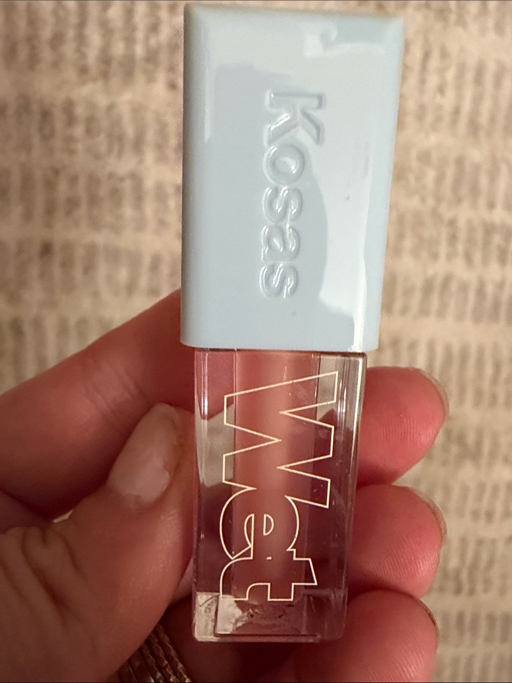 Kosas Sheer Pink-Tinted Lip Gloss with Pale Blue Cap